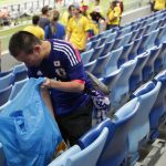considerate world cup fans from japan, senegal & uruguay pick up trash