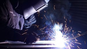 a welder making sparks