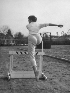 sheree north leaping over a hurdle