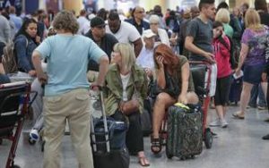 frustrated delta airlines passengers wait for their flights to be rescheduled