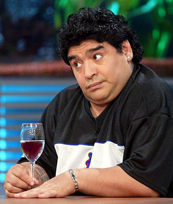 maradona enjoying a glass of wine