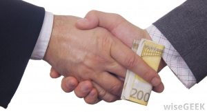 a handshake that includes a bribe 