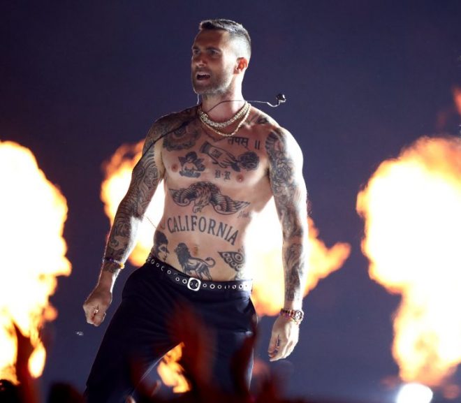 adam levine shirtless in front of fire