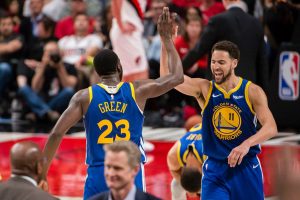 klay thompson high fives draymond green after the golden state warriors sweep the portland trailblazers in the 2019 nba western conference finals